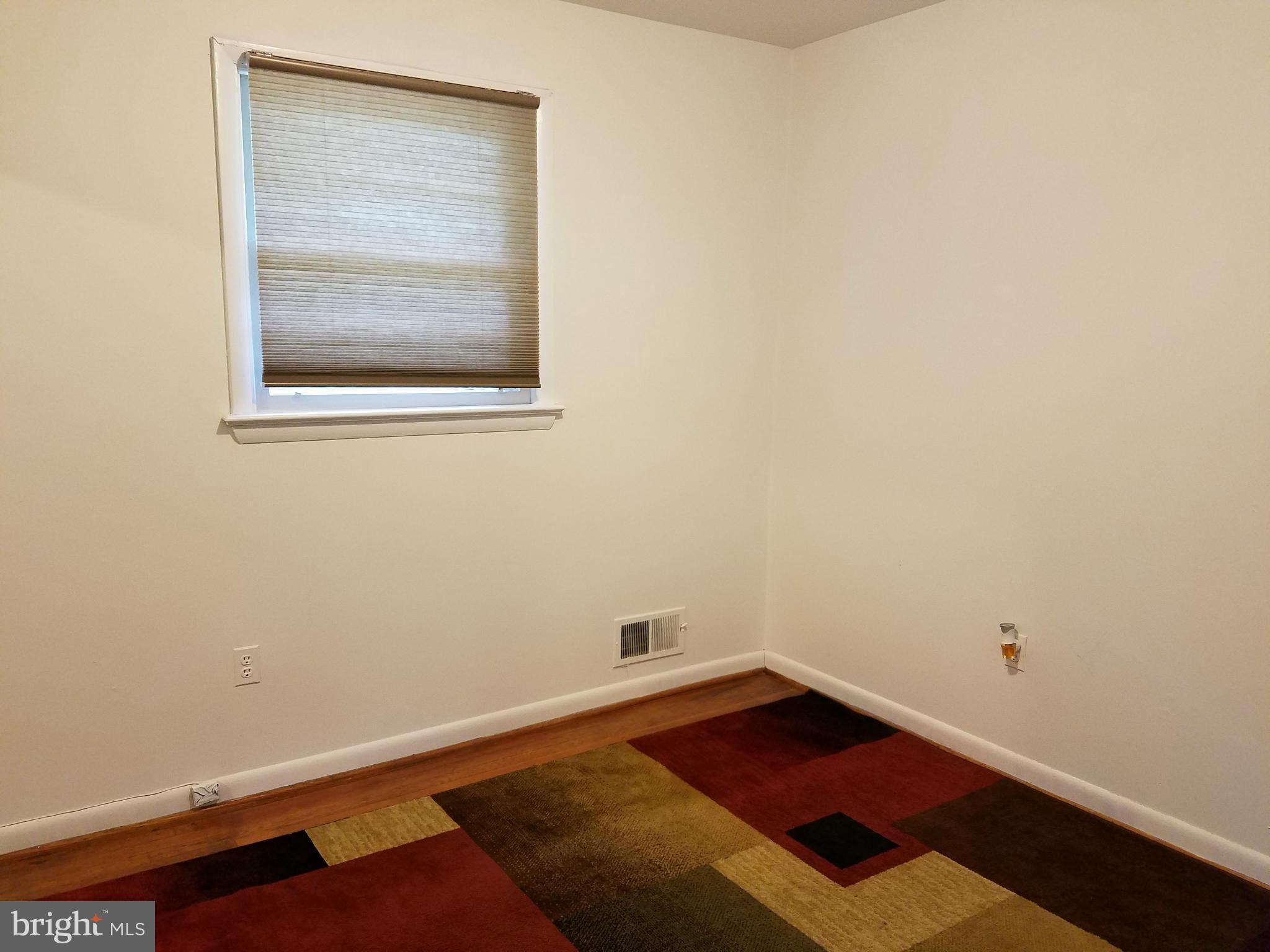 8506 Schultz Road Clinton, MD 20735 - Photo 12 of 30 an empty room with a bed