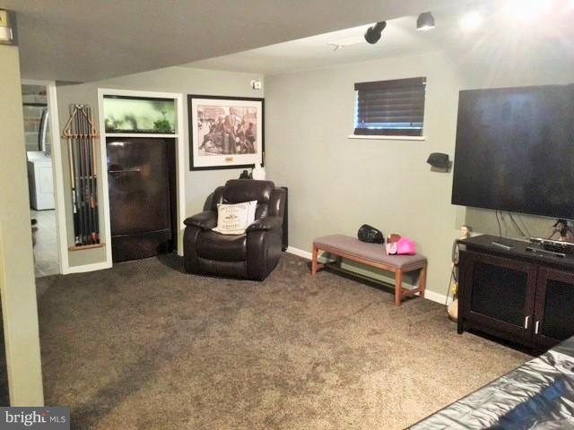 8506 Schultz Road Clinton, MD 20735 - Photo 19 of 30 a living room with furniture and a flat screen tv
