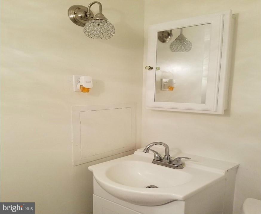 8506 Schultz Road Clinton, MD 20735 - Photo 24 of 30 a bathroom with a sink and a mirror