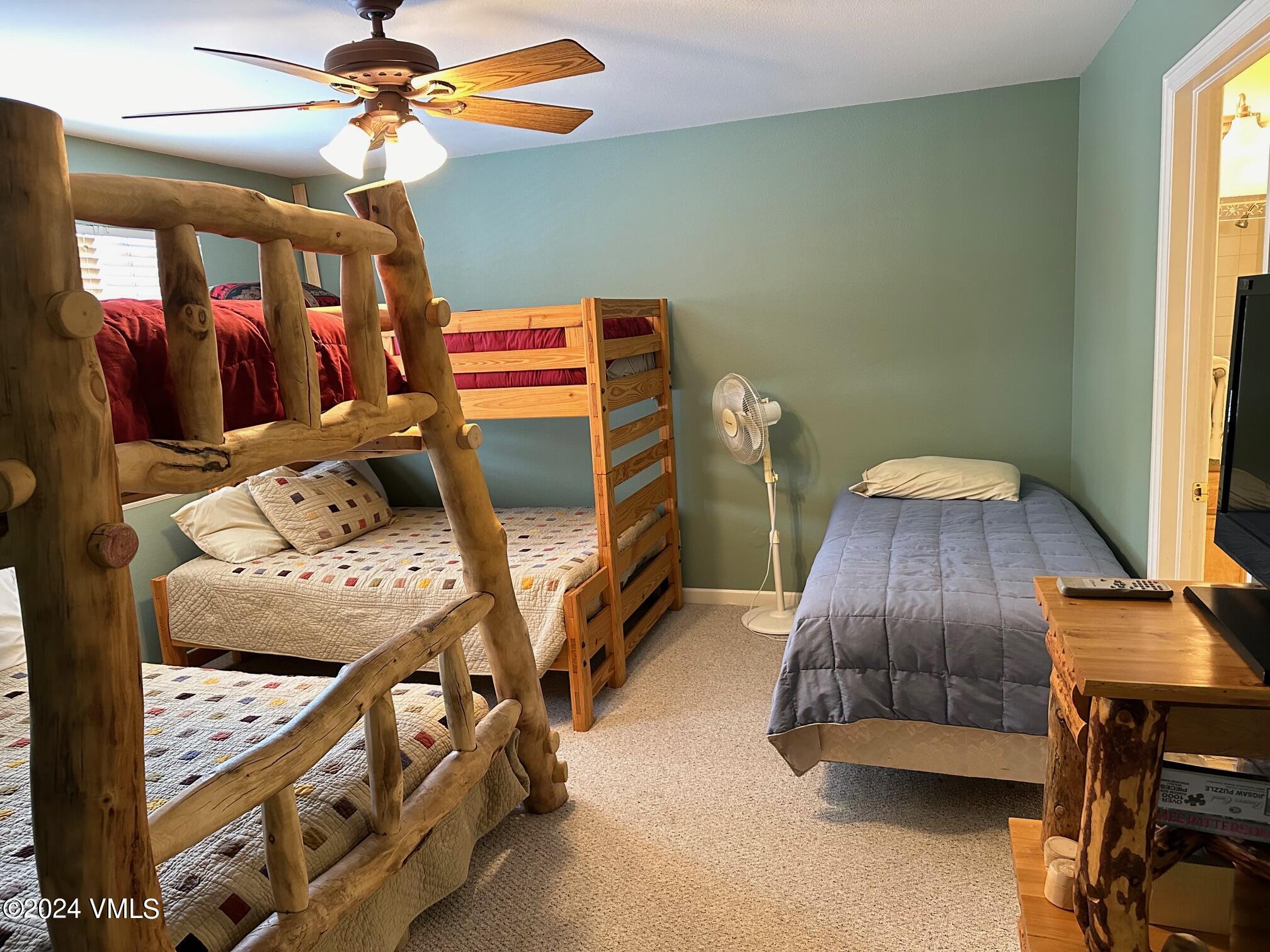 8 Red Tail Drive Edwards, CO 81632 - Photo 5 of 9 a bedroom with furniture and a mirror