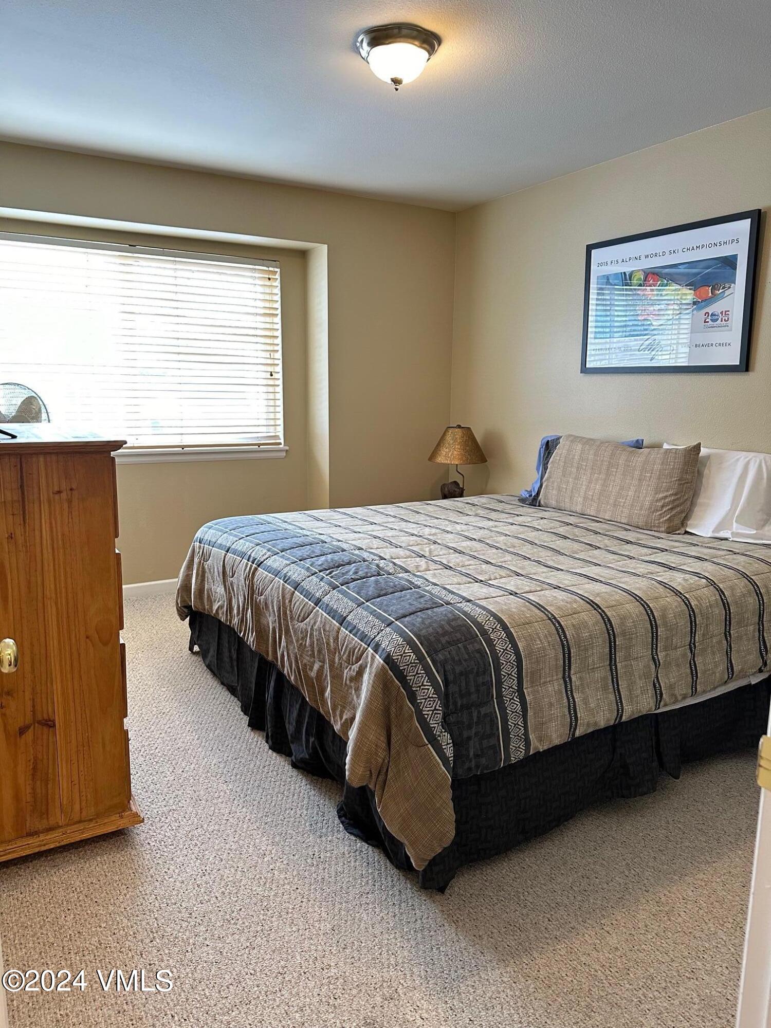 8 Red Tail Drive Edwards, CO 81632 - Photo 7 of 9 a bed sitting in a bedroom next to a window