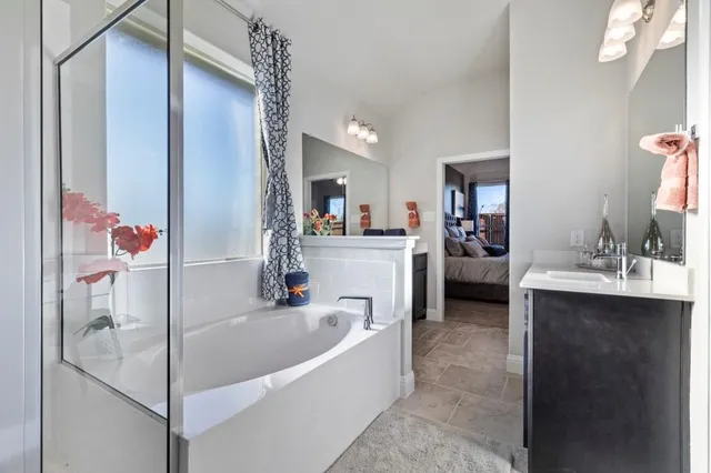 a bathroom with sink and mirror