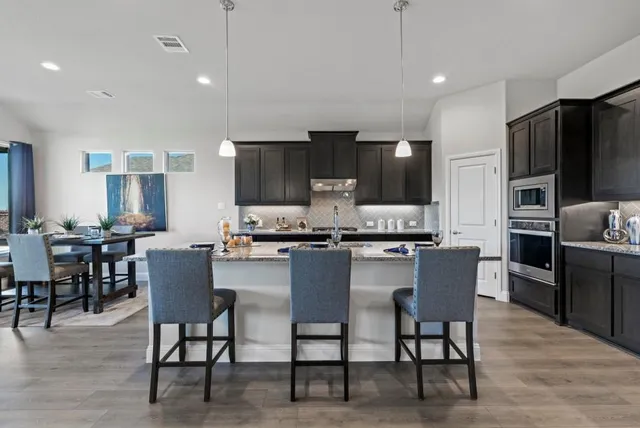 a kitchen with granite countertop lots of counter top space