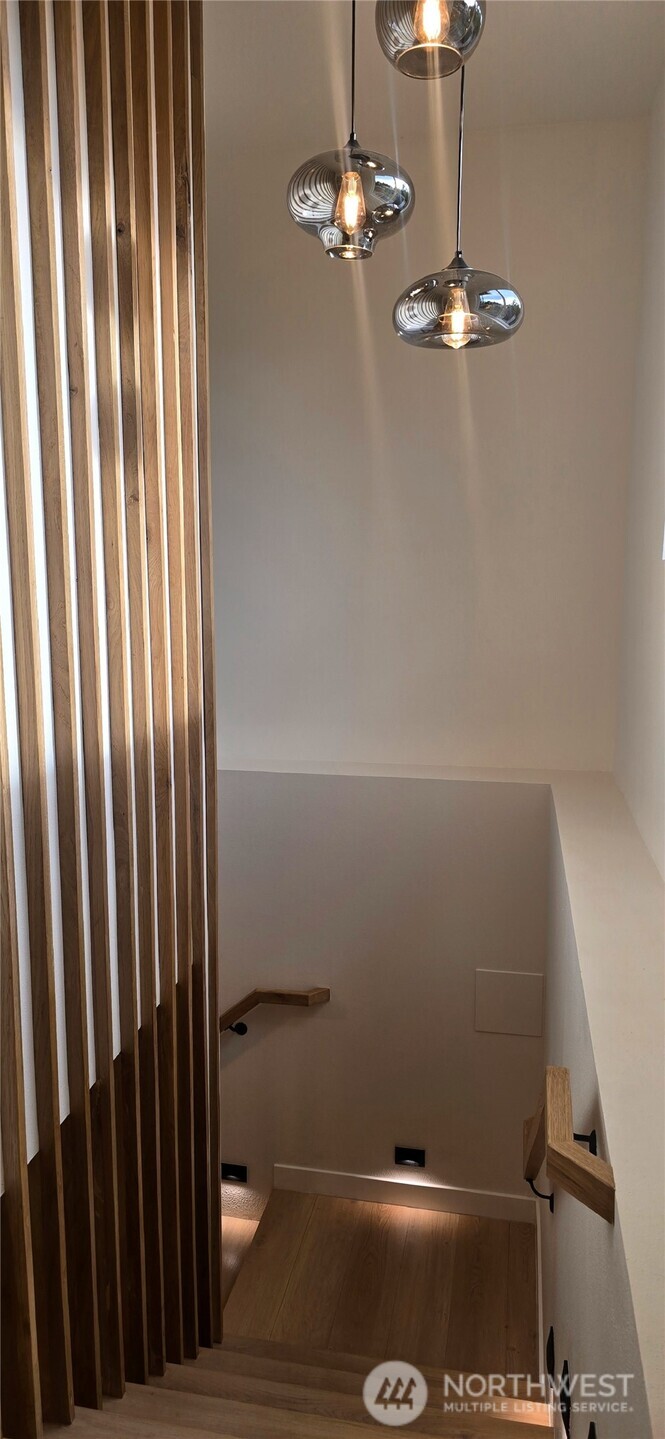 8421 39th Avenue Southwest Seattle, WA 98136 - Photo 10 of 24 a view of a room with racks on the wall