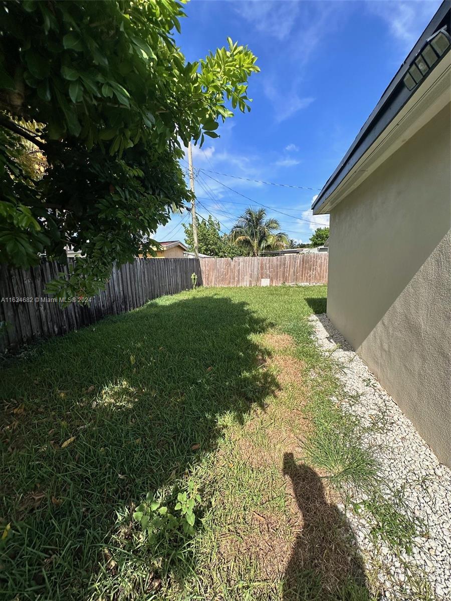 6517 Wiley Street Hollywood, FL 33023 - Photo 15 of 17 a view of a backyard of the house