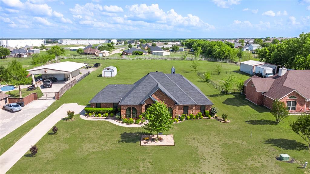 an aerial view of a house with garden space and outdoor space