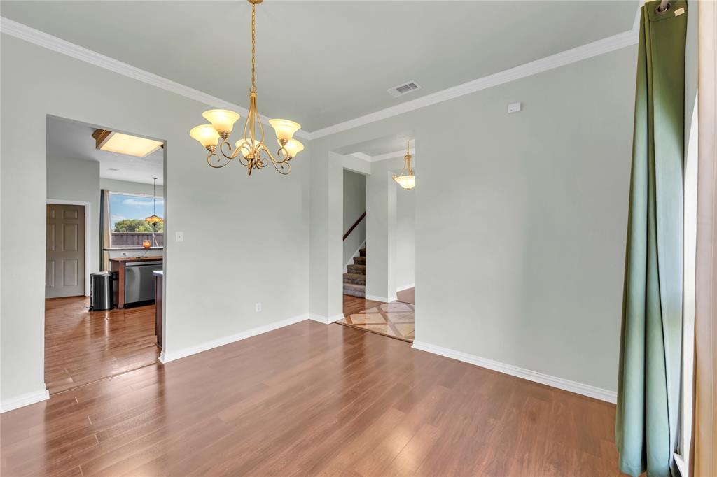 16055 Prairie Meadow Forney, TX 75126 - Photo 15 of 33 a view of a big room with wooden floor a chandelier and entryway