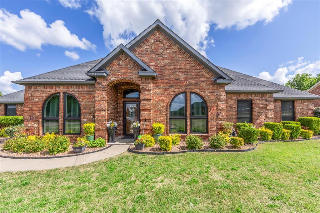 16055 Prairie Meadow Forney, TX 75126 - Photo 2 of 33 a front view of a house with garden