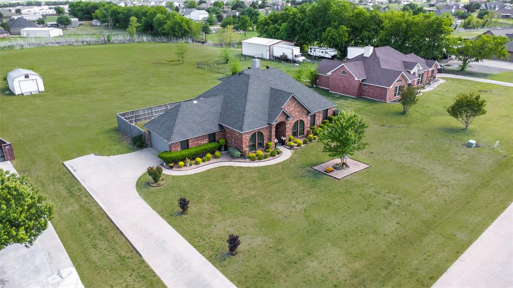 16055 Prairie Meadow Forney, TX 75126 - Photo 31 of 33 an aerial view of a house with a garden and lake view