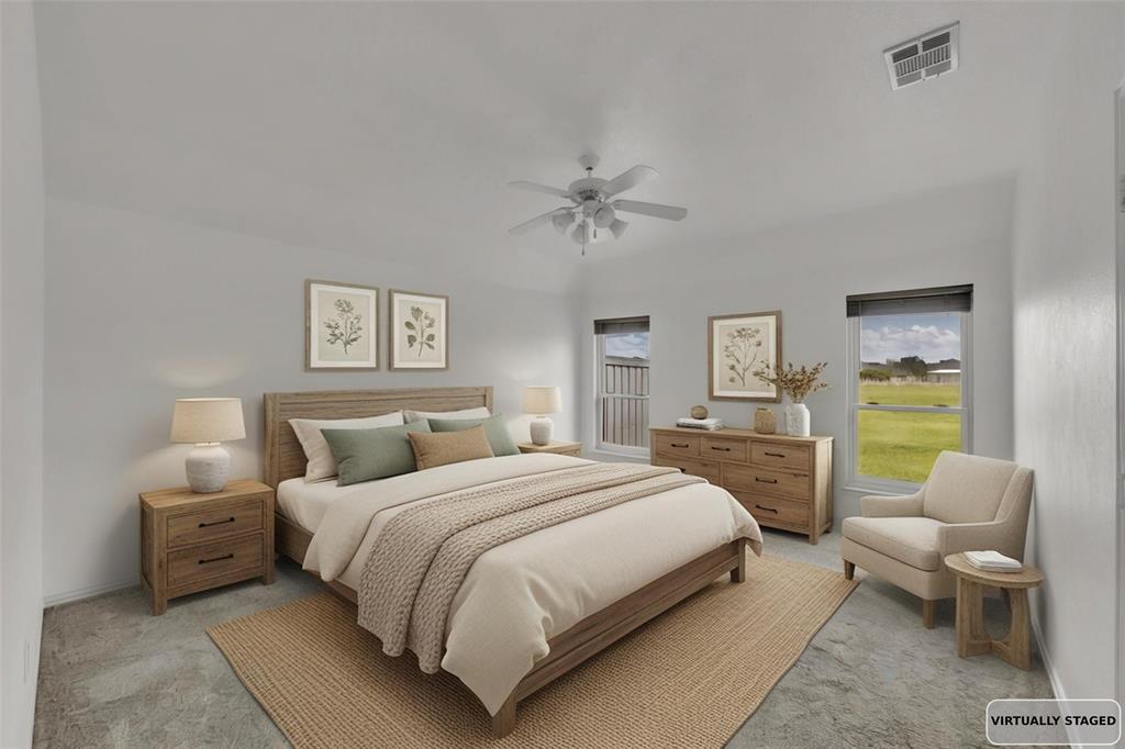 16055 Prairie Meadow Forney, TX 75126 - Photo 7 of 33 a bedroom with a bed and a couch