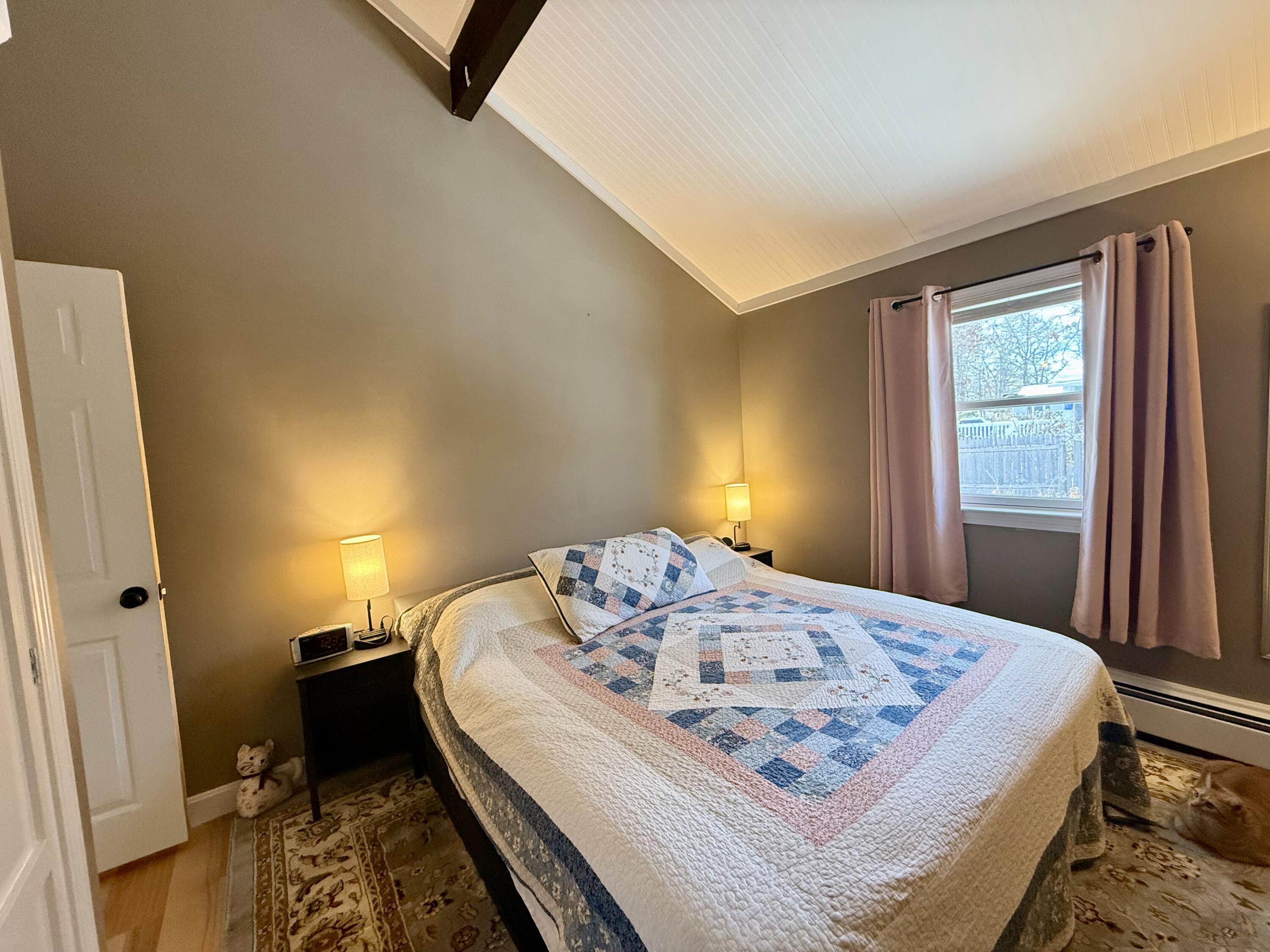 60 Ashumet Avenue Mashpee, MA 02649 - Photo 15 of 30 a bedroom with a bed and a dresser