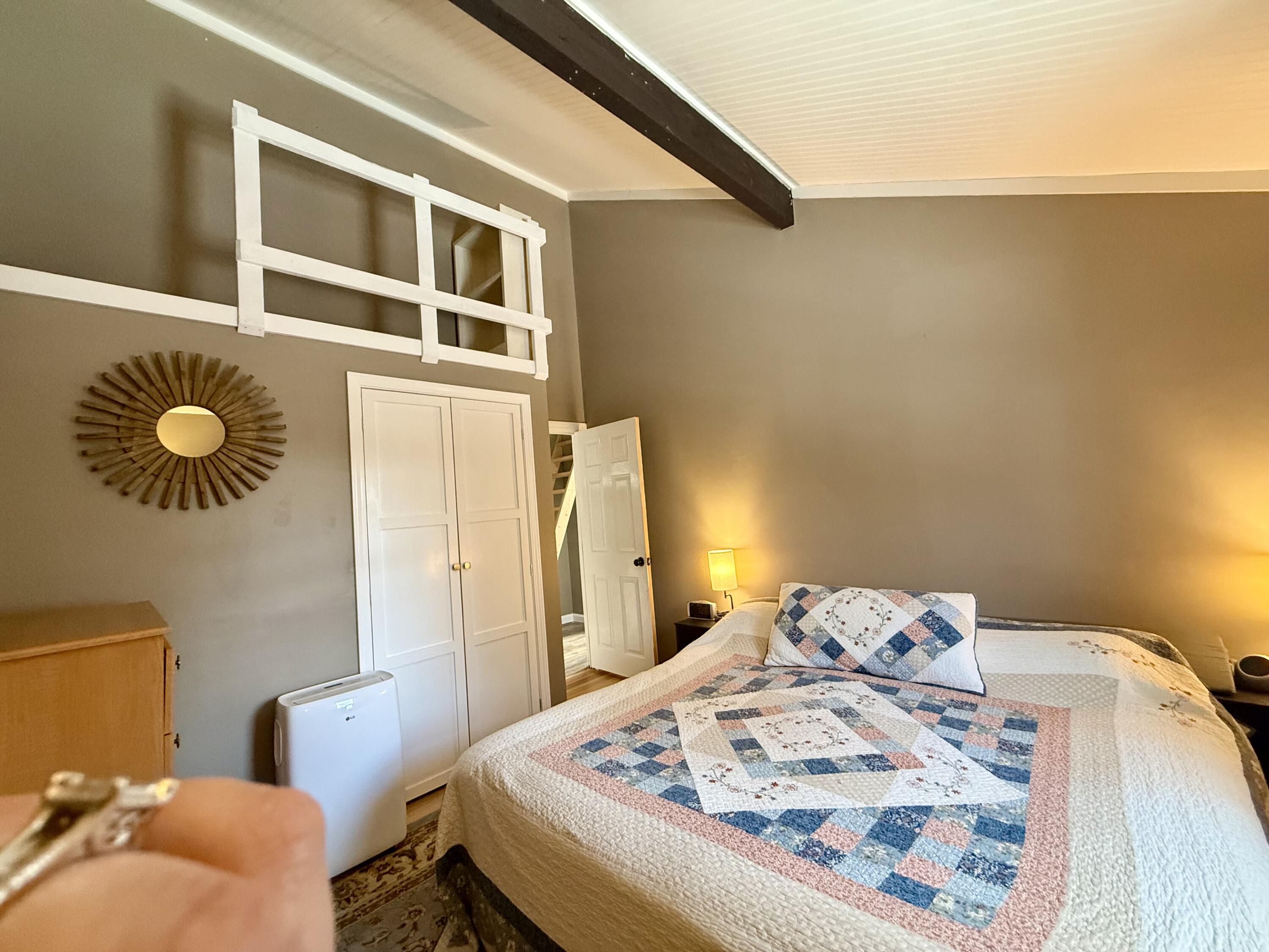 60 Ashumet Avenue Mashpee, MA 02649 - Photo 16 of 30 a bed sitting in a bedroom next to a window