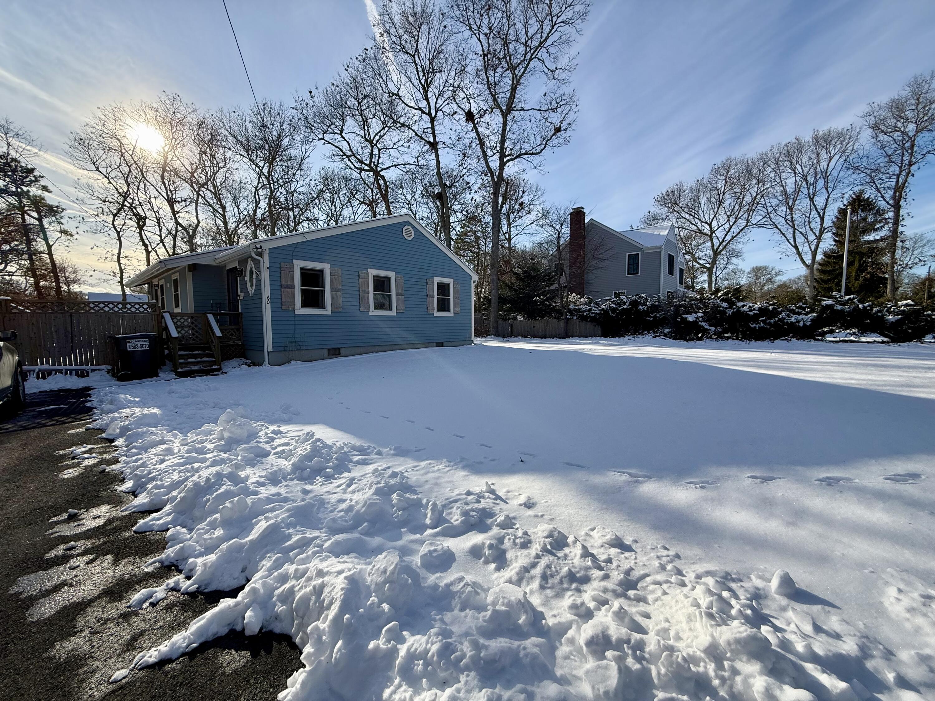 60 Ashumet Avenue Mashpee, MA 02649 - Photo 2 of 30 a view of a house with a snow in front of it