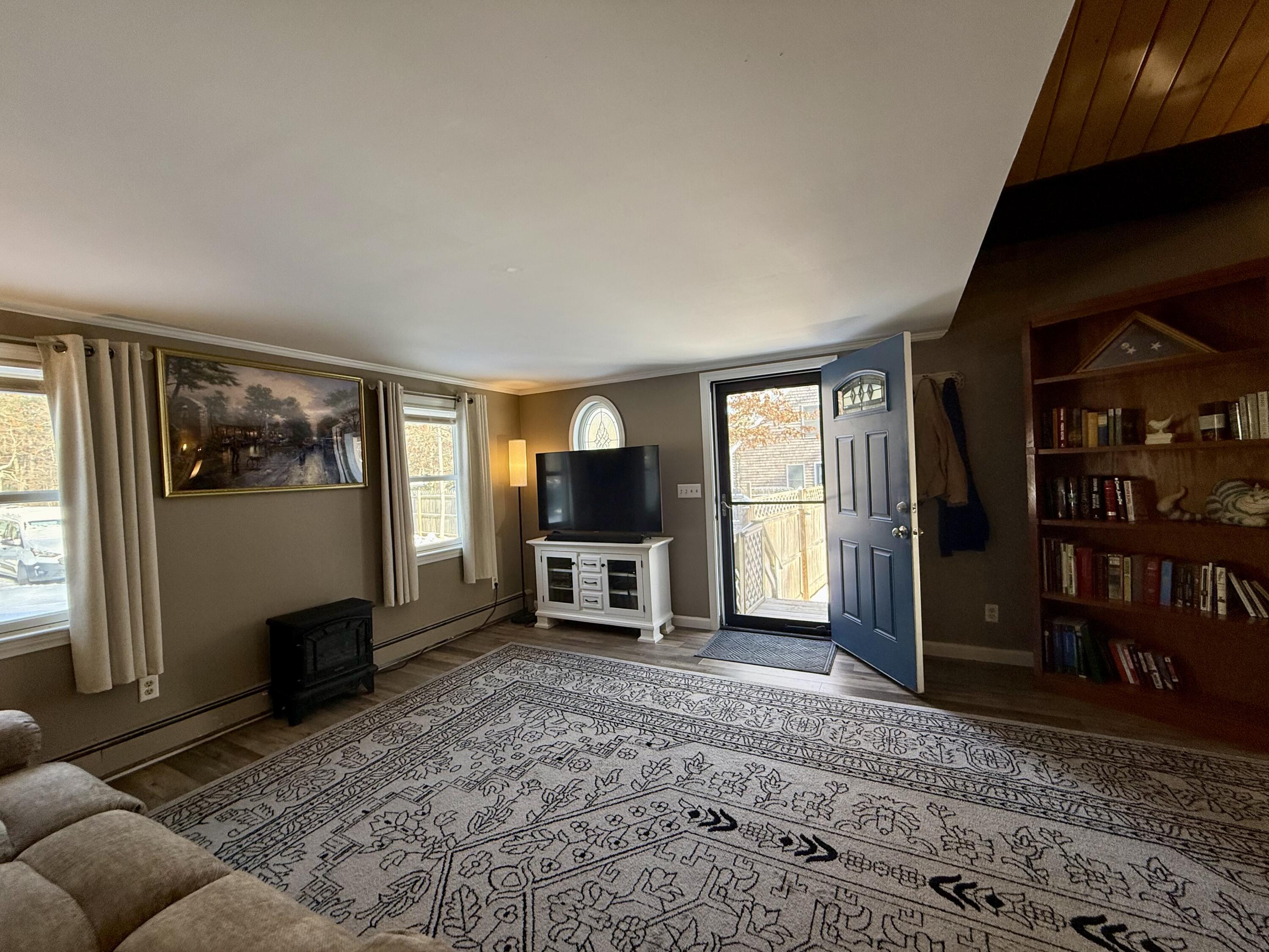 60 Ashumet Avenue Mashpee, MA 02649 - Photo 5 of 30 a living room with furniture and a flat screen tv