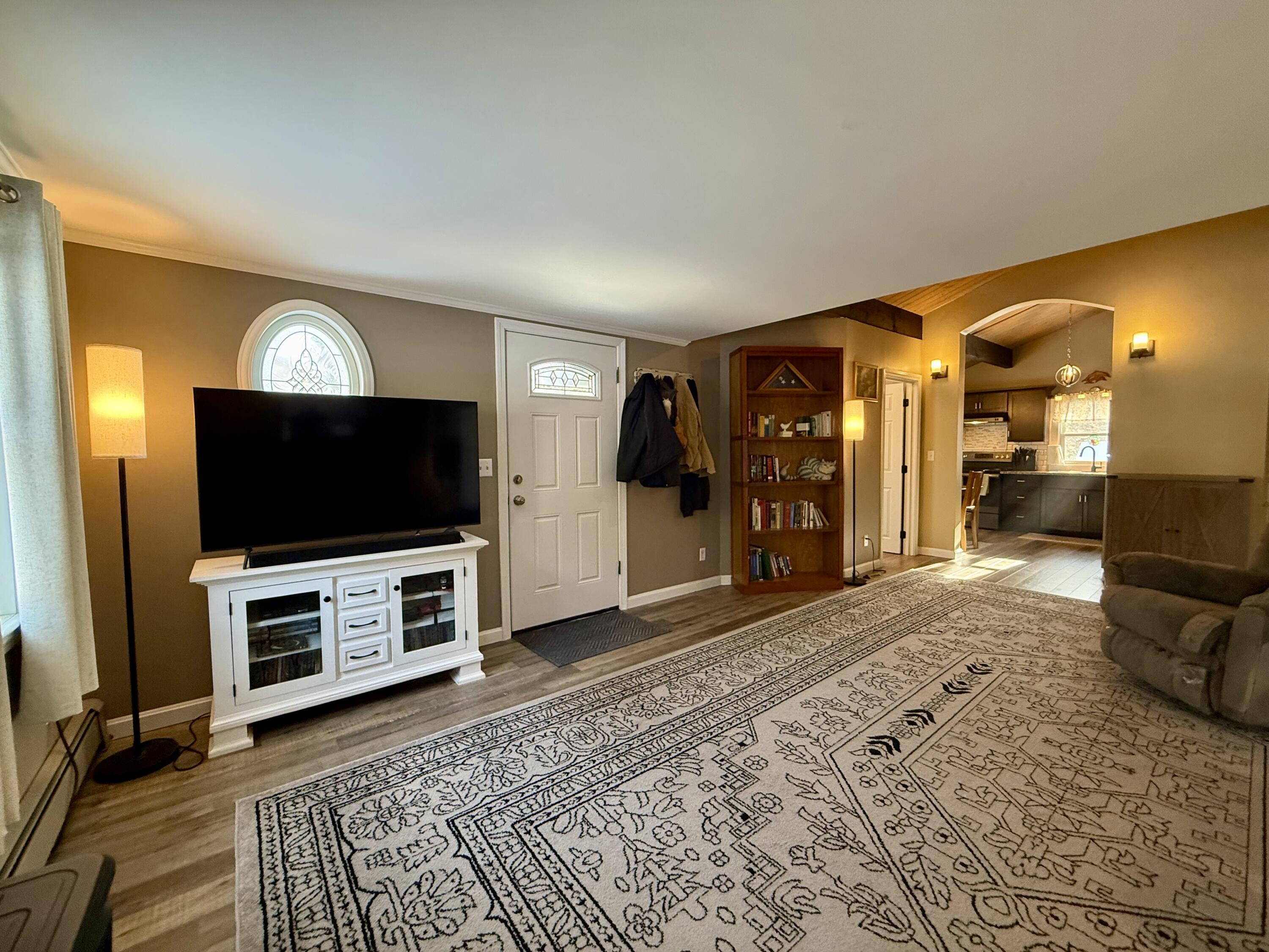 60 Ashumet Avenue Mashpee, MA 02649 - Photo 6 of 30 a living room with furniture and a flat screen tv