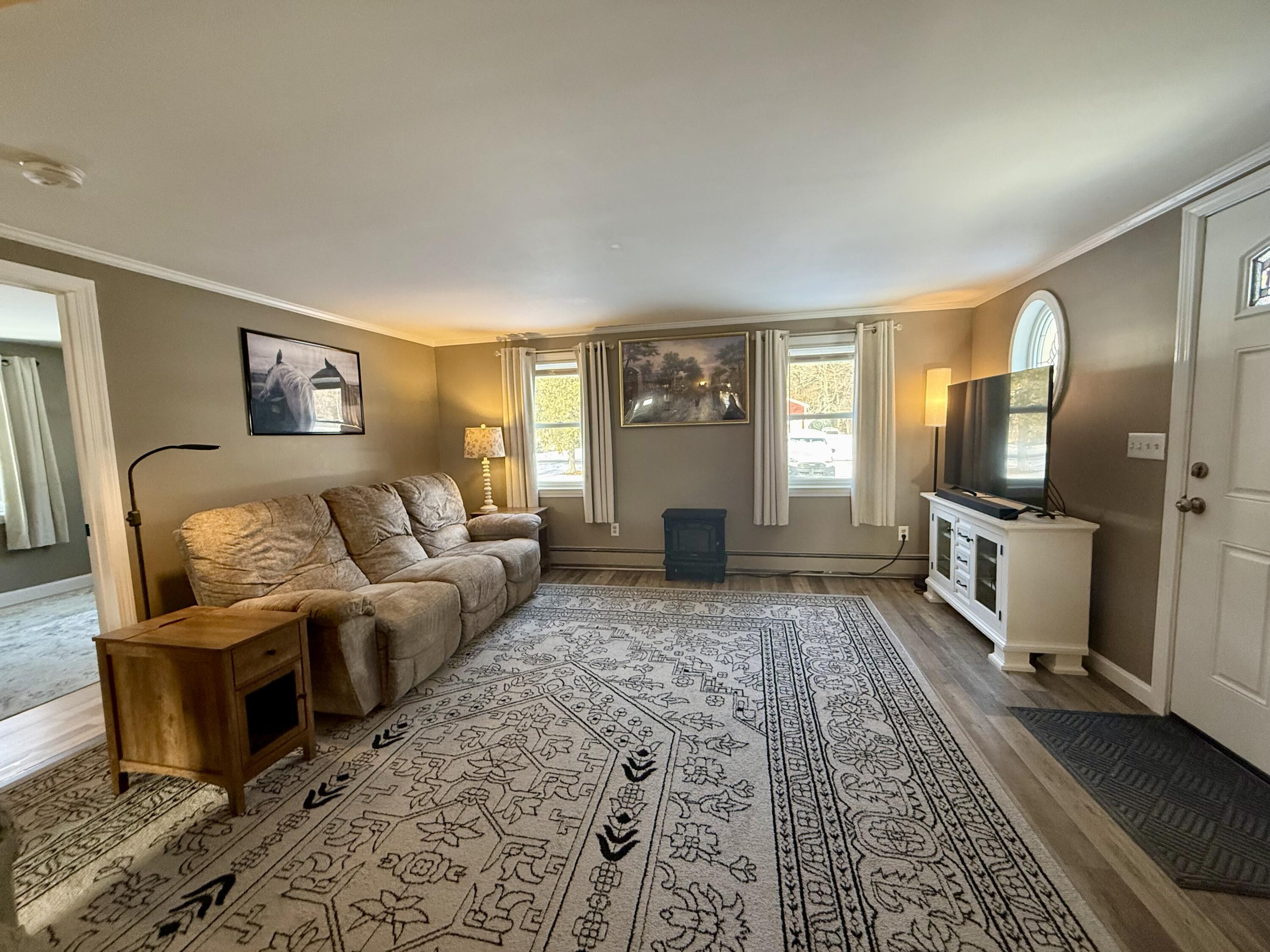 60 Ashumet Avenue Mashpee, MA 02649 - Photo 8 of 30 a living room with furniture and a flat screen tv
