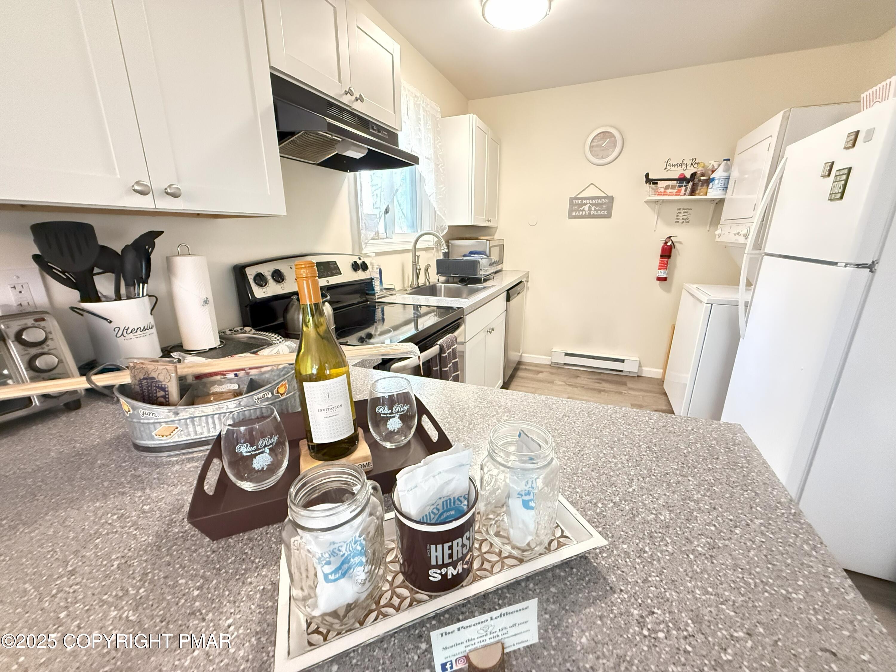 1026 Hampstead Road Bushkill, PA 18324 - Photo 19 of 61 a kitchen with a refrigerator and a stove