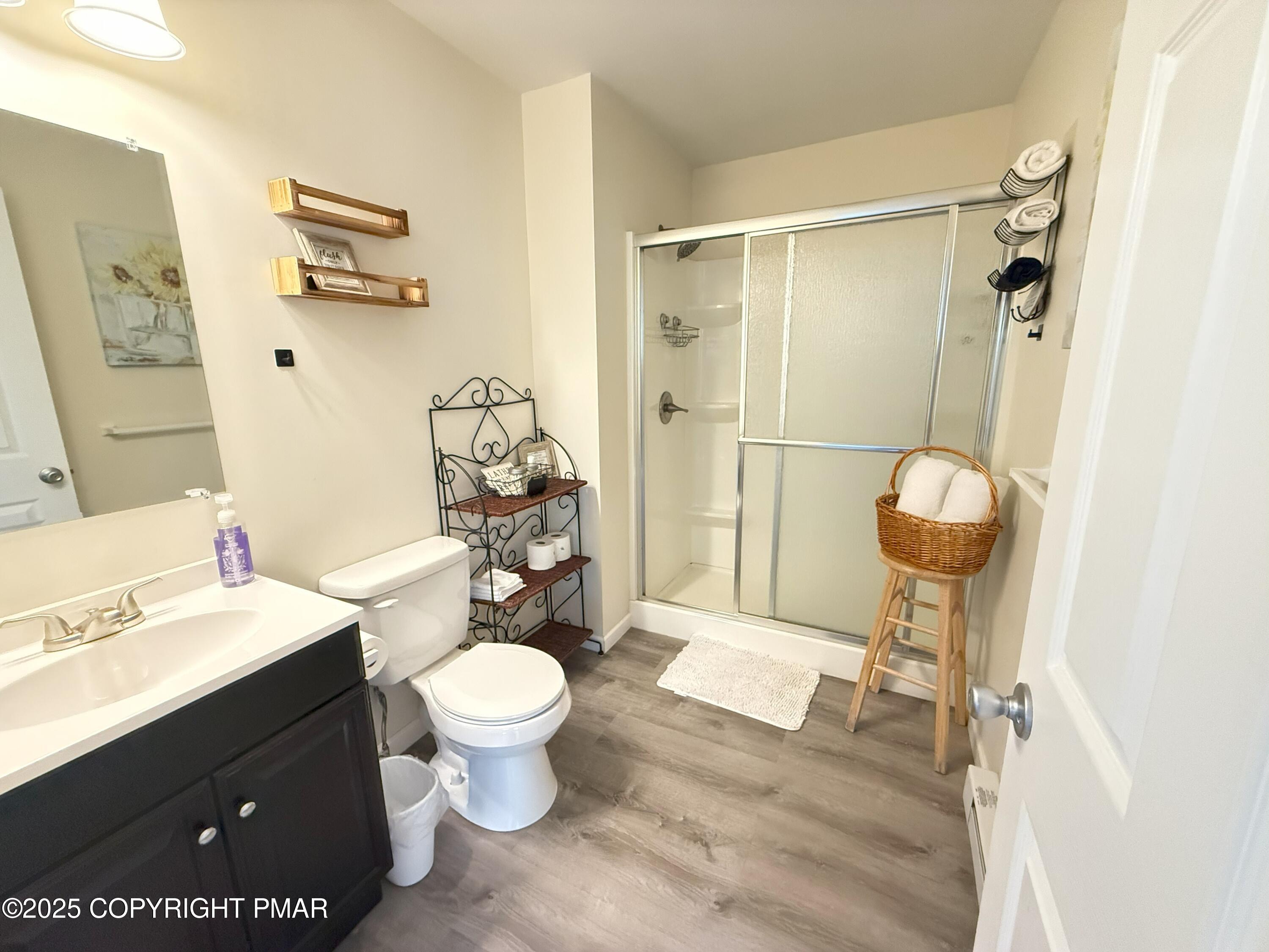 1026 Hampstead Road Bushkill, PA 18324 - Photo 24 of 61 a bathroom with a toilet a sink and a mirror