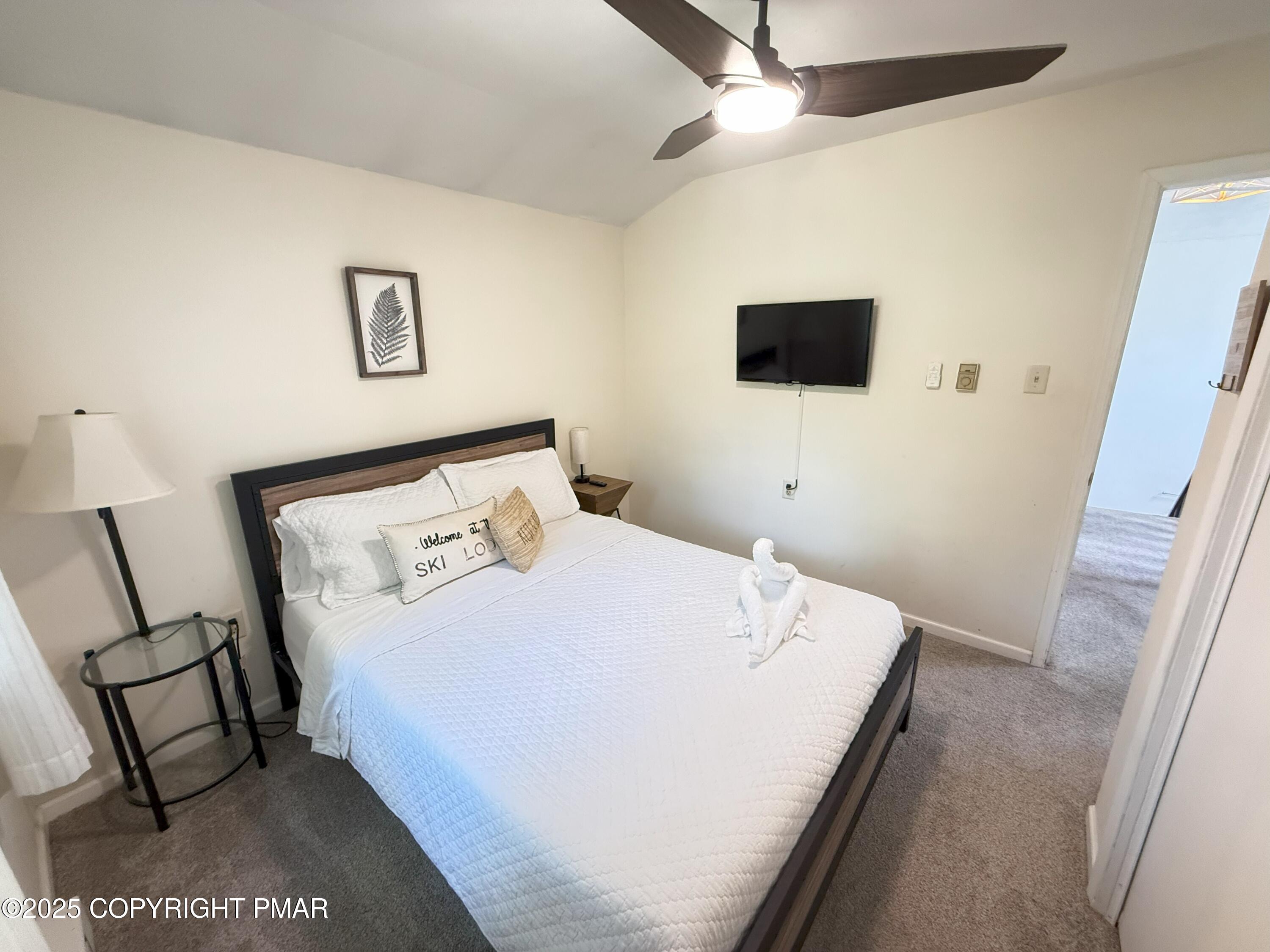 1026 Hampstead Road Bushkill, PA 18324 - Photo 25 of 61 a bedroom with a bed and a flat screen tv