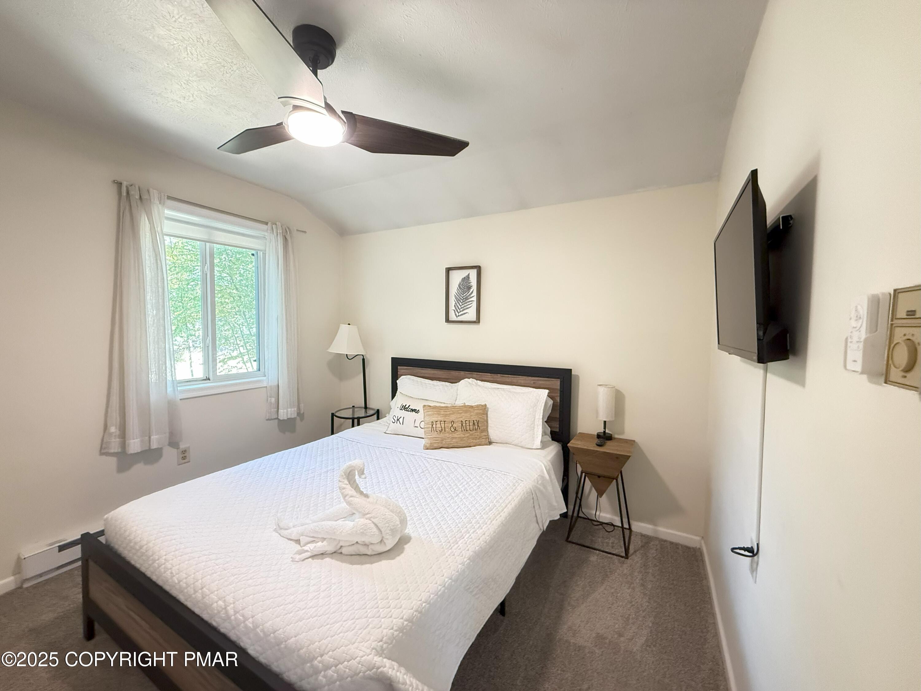 1026 Hampstead Road Bushkill, PA 18324 - Photo 26 of 61 a bedroom with a bed and a flat screen tv