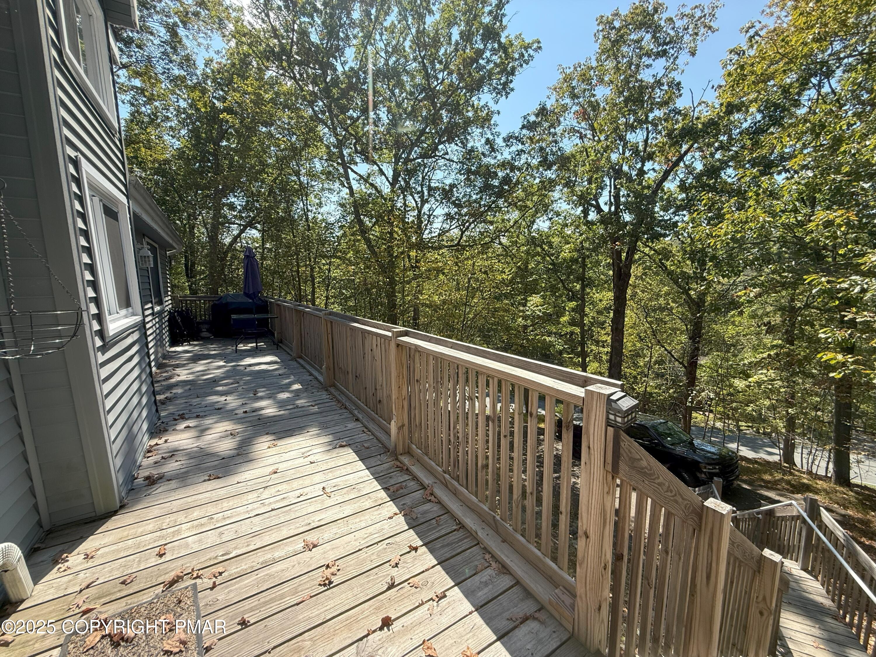 1026 Hampstead Road Bushkill, PA 18324 - Photo 36 of 61 a view of a wooden balcony and trees