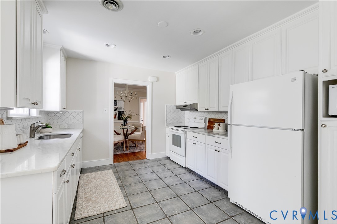 609 Baldwin Road Henrico, VA 23229 - Photo 19 of 50 a kitchen with a refrigerator sink and cabinets