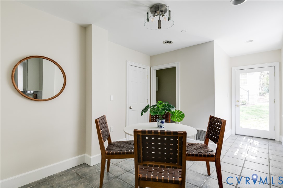 609 Baldwin Road Henrico, VA 23229 - Photo 21 of 50 a dining room with furniture and a potted plant