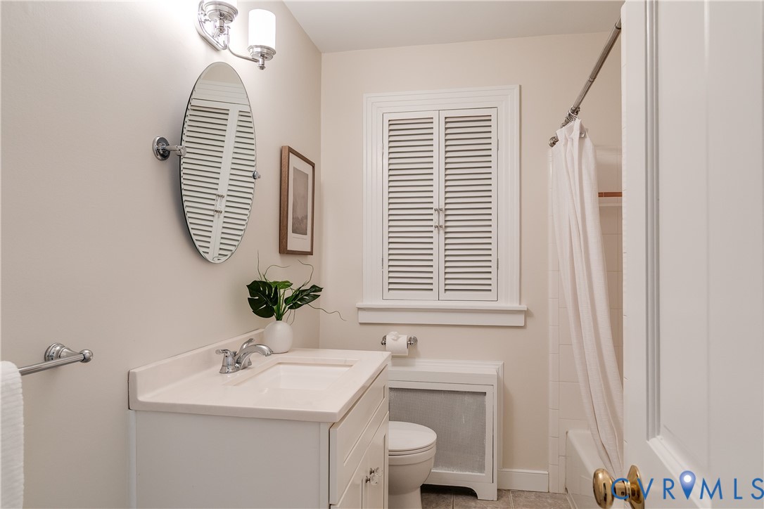 609 Baldwin Road Henrico, VA 23229 - Photo 37 of 50 a bathroom with a sink a toilet and mirror