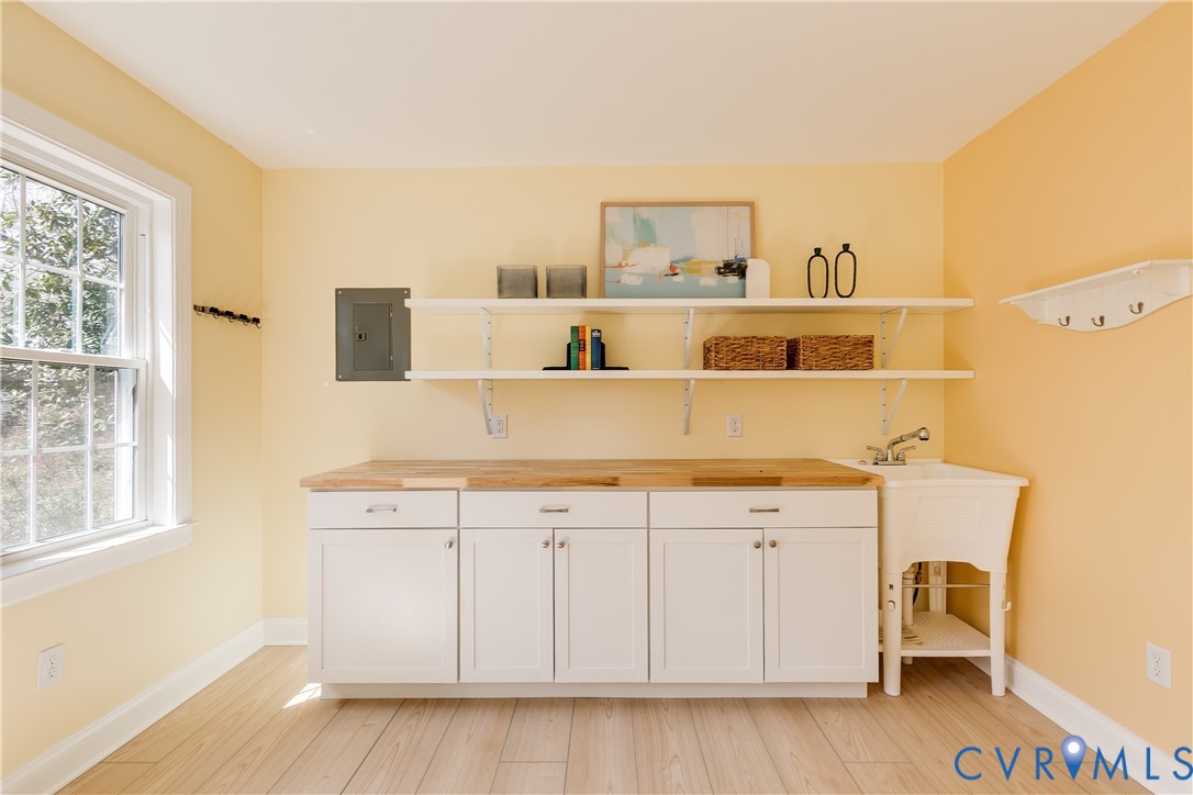 609 Baldwin Road Henrico, VA 23229 - Photo 45 of 50 a view of a kitchen with wooden floor and cabinets