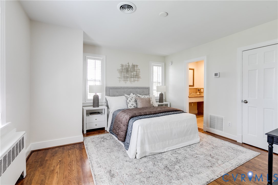 609 Baldwin Road Henrico, VA 23229 - Photo 9 of 50 a bedroom with a bed and wooden floor