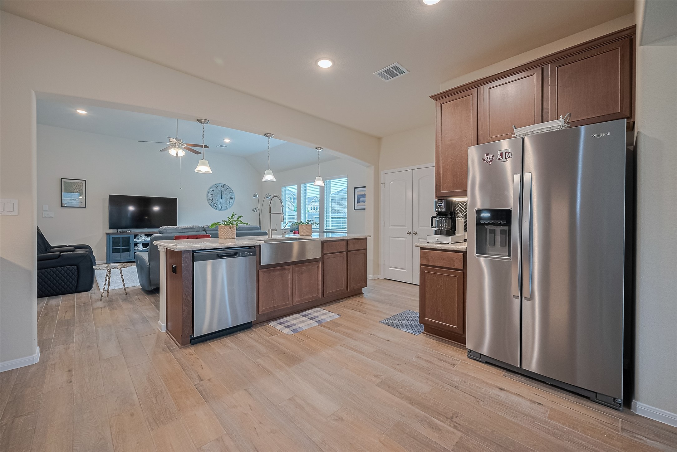 5802 Ashland Lane Pasadena, TX 77505 - Photo 14 of 50 a kitchen with stainless steel appliances kitchen island granite countertop a refrigerator a stove top oven and a sink
