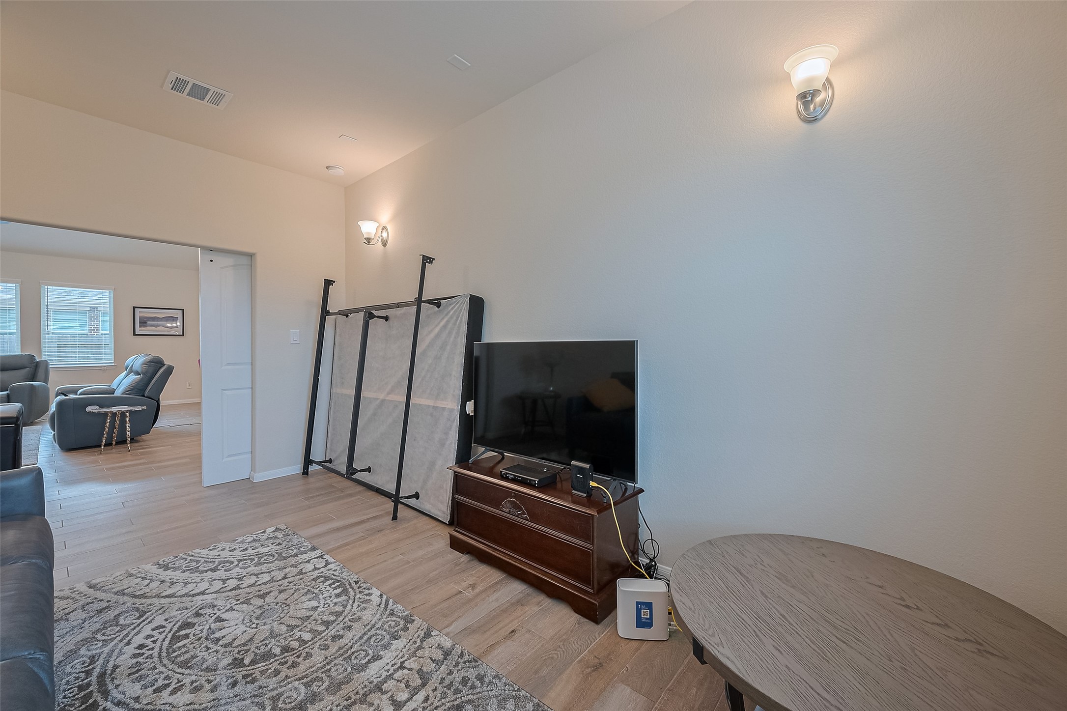 5802 Ashland Lane Pasadena, TX 77505 - Photo 24 of 50 a living room with furniture and a flat screen tv