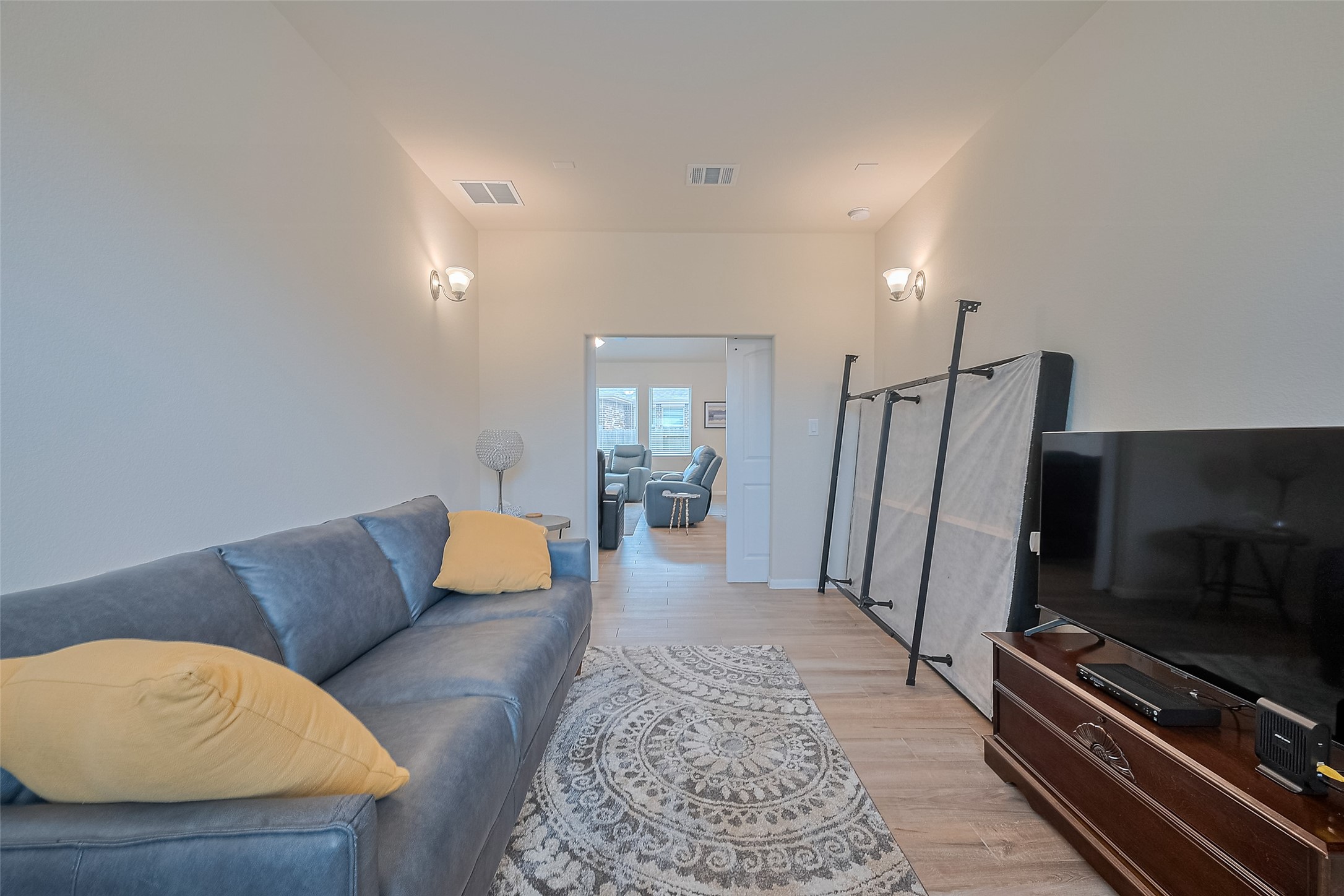5802 Ashland Lane Pasadena, TX 77505 - Photo 25 of 50 a living room with furniture and a flat screen tv