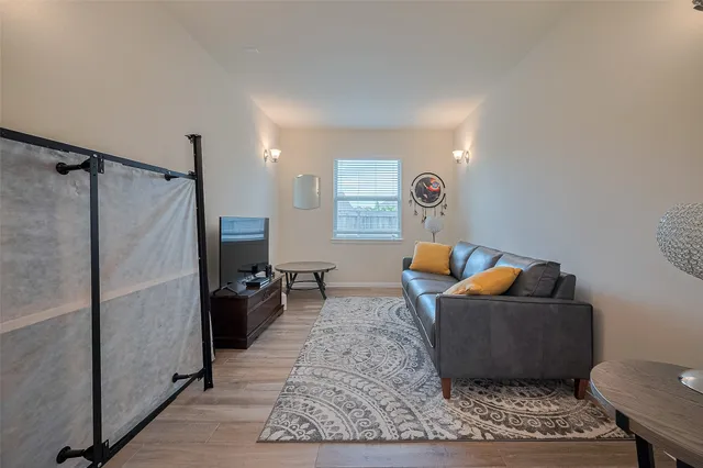 a living room with furniture and a rug