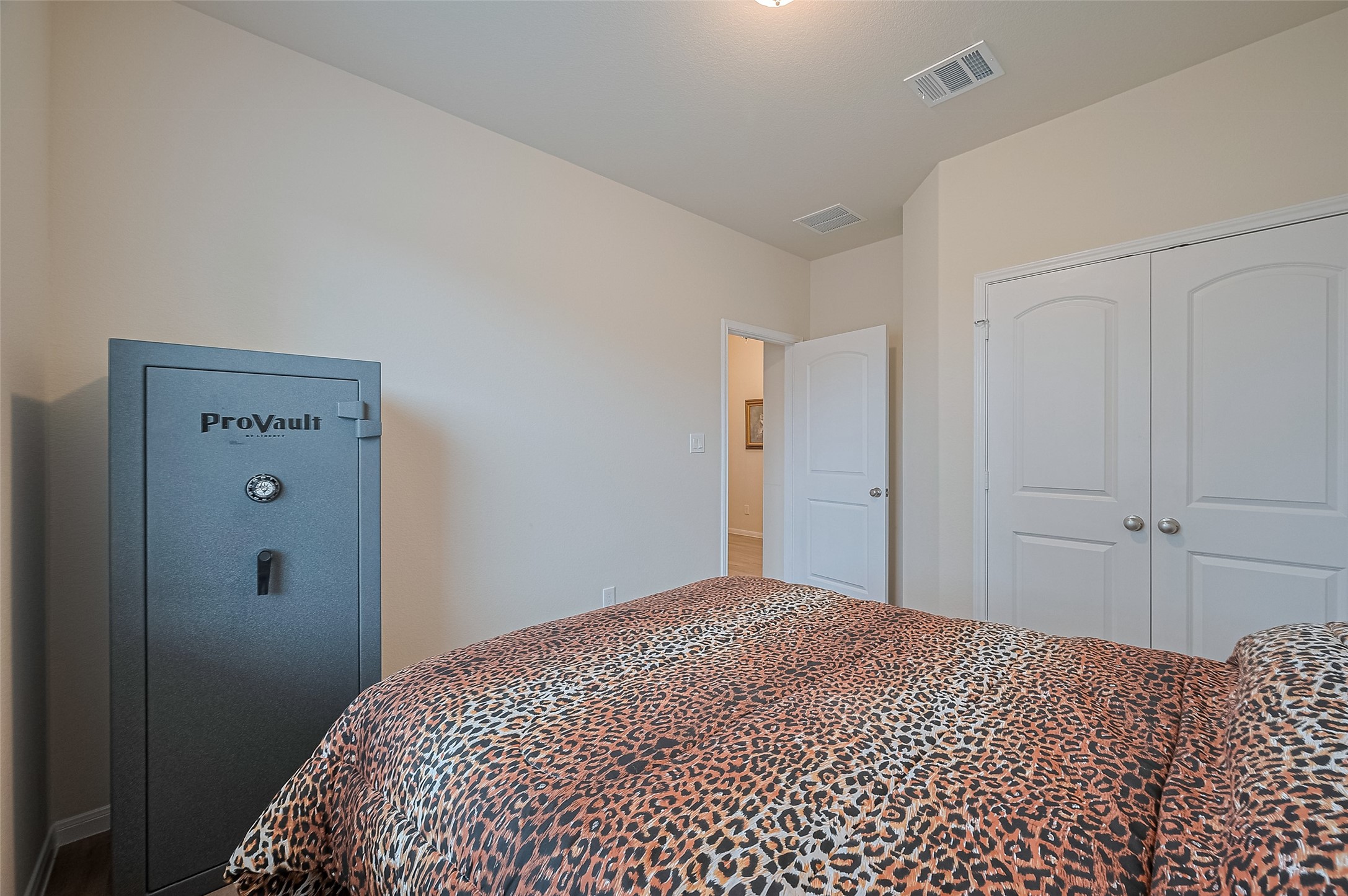 5802 Ashland Lane Pasadena, TX 77505 - Photo 28 of 50 a bedroom with a bed and a cabinet