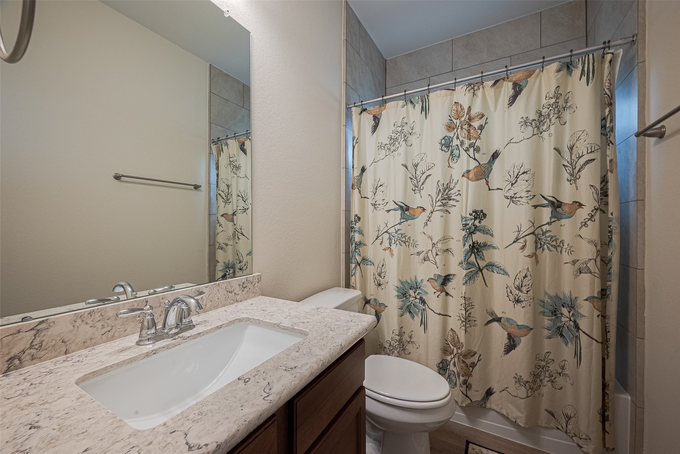 5802 Ashland Lane Pasadena, TX 77505 - Photo 34 of 50 a bathroom with a granite countertop sink toilet and a mirror