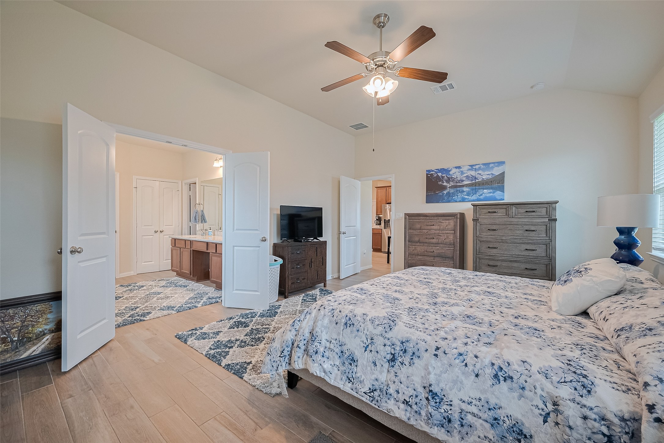 5802 Ashland Lane Pasadena, TX 77505 - Photo 35 of 50 a bedroom with a large bed a flat tv screen and dresser