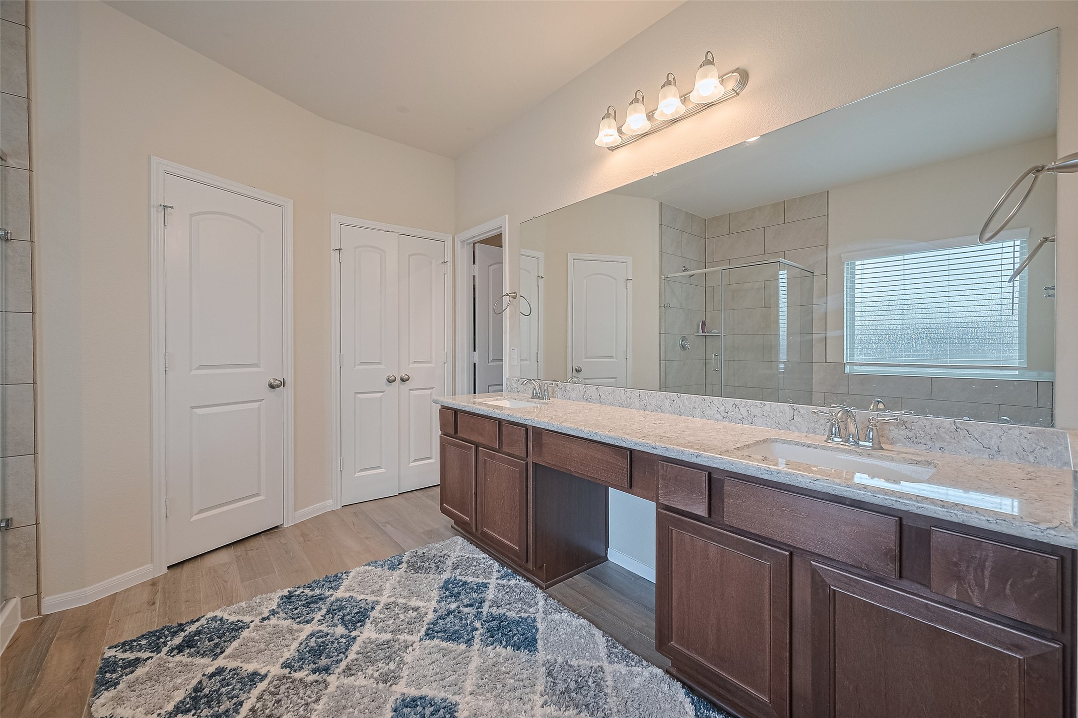5802 Ashland Lane Pasadena, TX 77505 - Photo 41 of 50 a spacious bathroom with a double vanity sink and a mirror