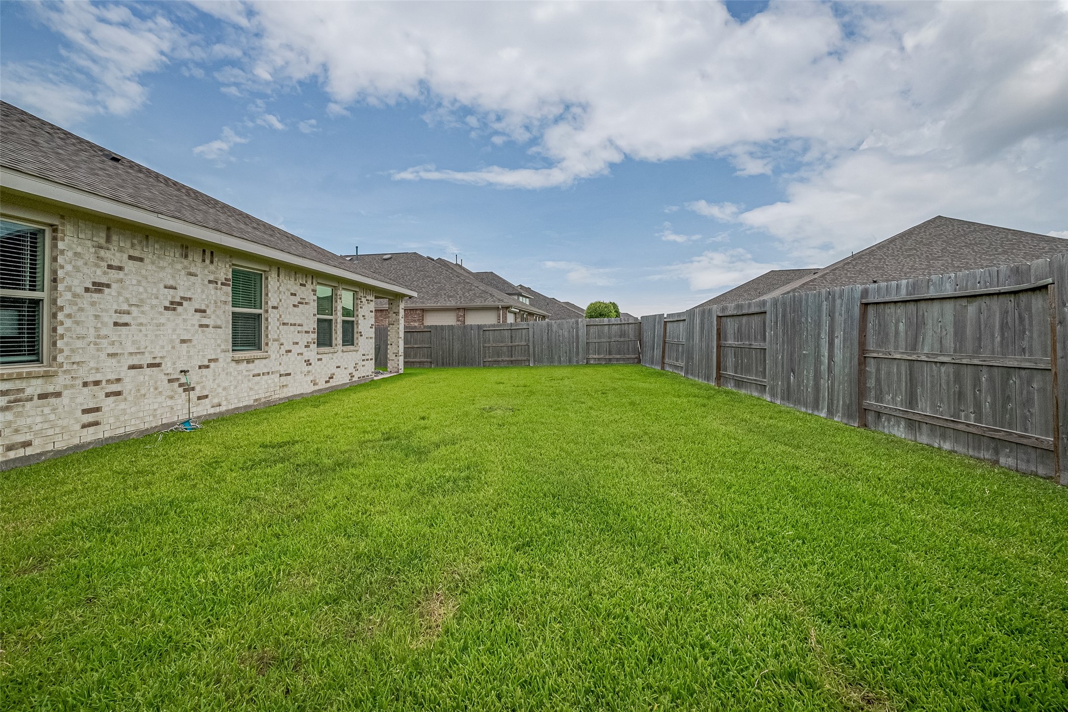 5802 Ashland Lane Pasadena, TX 77505 - Photo 44 of 50 a view of a backyard with plants and large trees