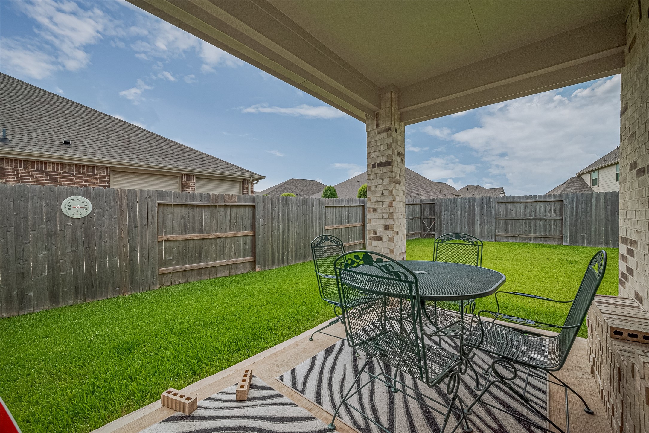 5802 Ashland Lane Pasadena, TX 77505 - Photo 50 of 50 a view of a chair and table in backyard of the house