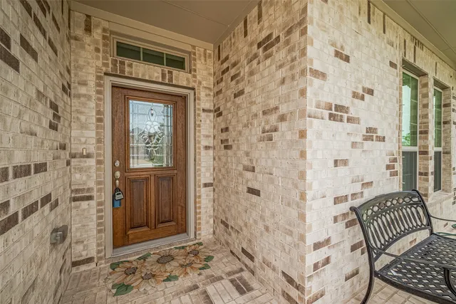 a bathroom with a shower and a sink