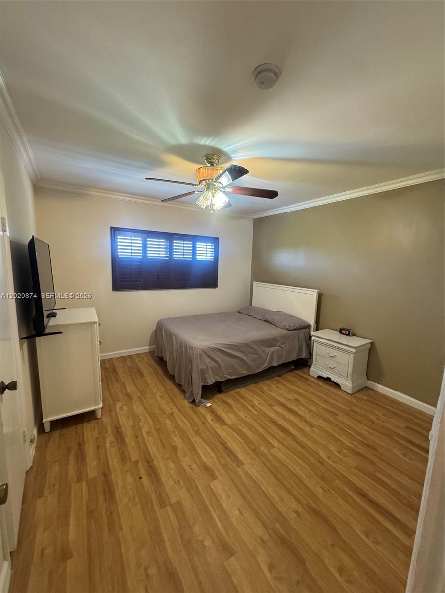 6731 Cypress Road, Unit 410 Plantation, FL 33317 - Photo 6 of 15 a bedroom with double bed and a night stand