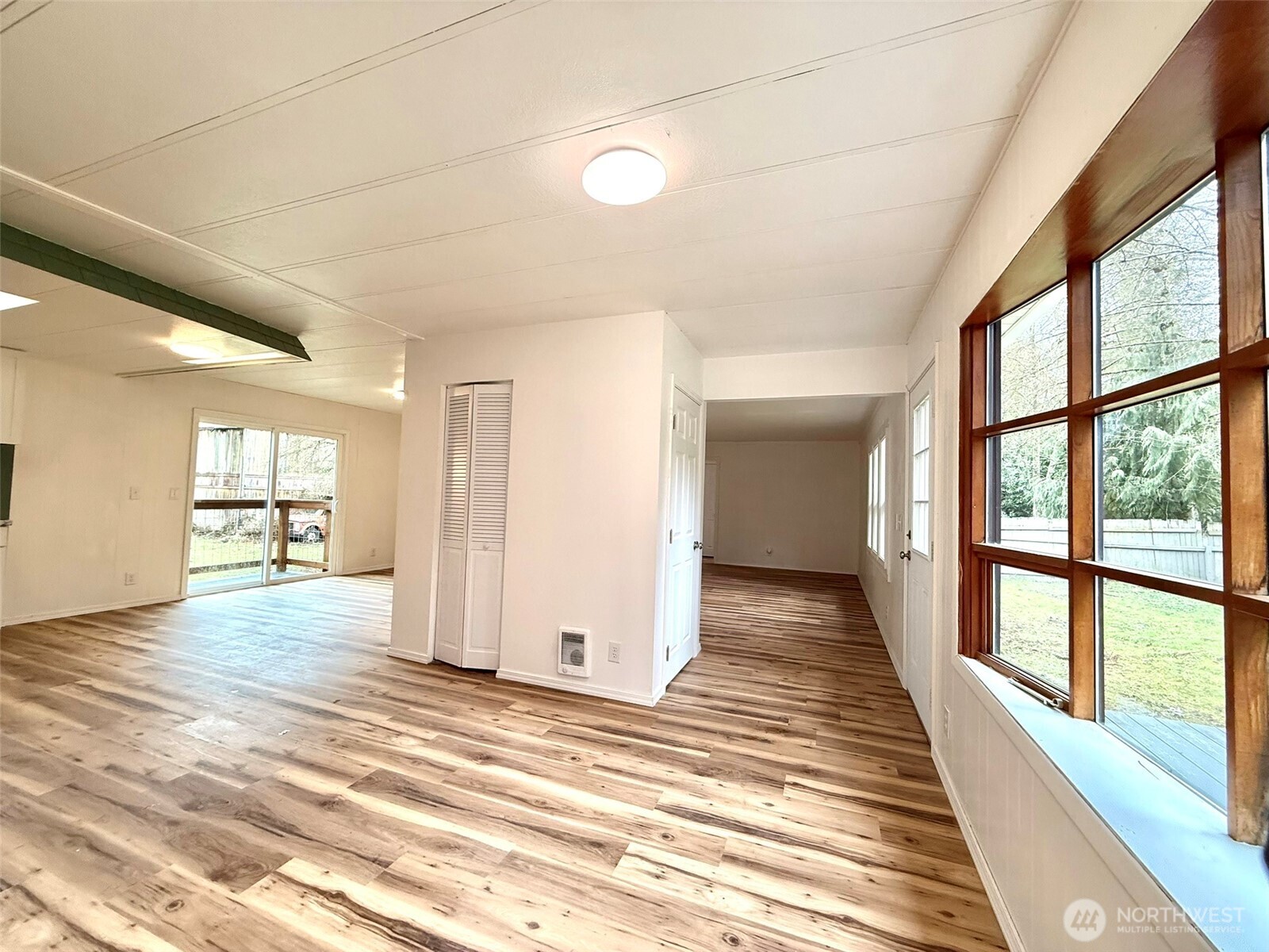 22513 South Forest Loop Road Granite Falls, WA 98252 - Photo 10 of 39 a view of a room with wooden floor and windows