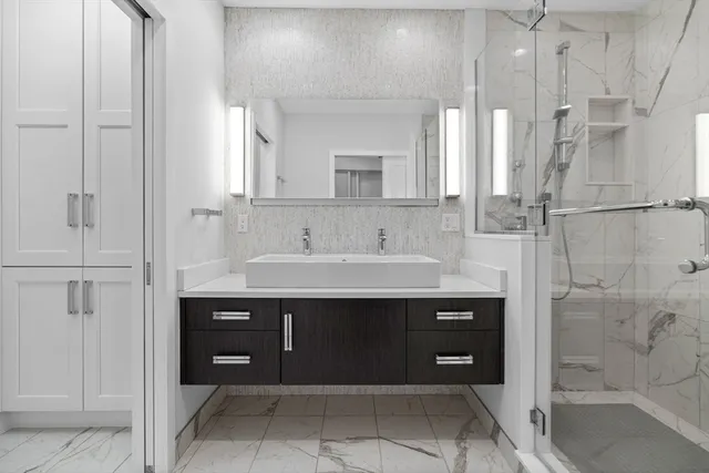 a bathroom with a sink and a mirror