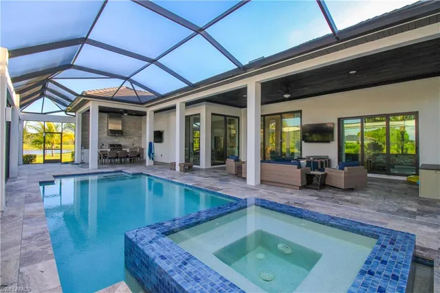 a view of swimming pool with outdoor seating