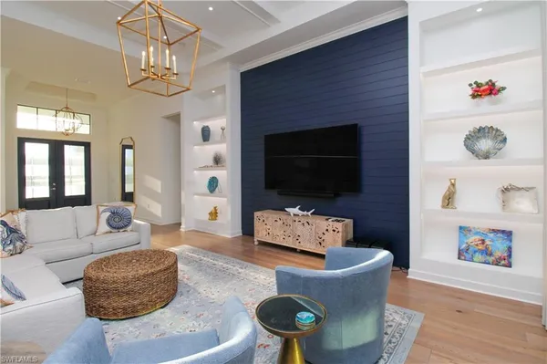a living room with furniture and a flat screen tv