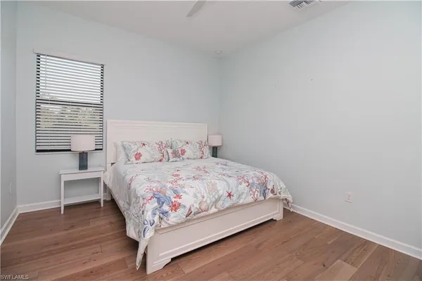 a bedroom with a bed and a table