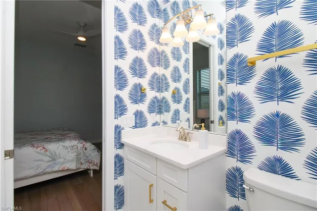 a en suite bathroom with a sink and a mirror