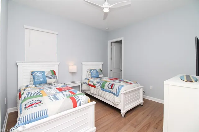 a bedroom with a bed and a table in it