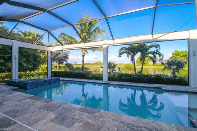 a view of swimming pool with a yard